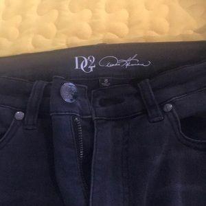Black jeans with embroidered stitches.